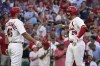 St. Louis Cardinals' Nolan Arenado (28) is congratulated by teammate Paul Goldschmidt (46) after hitting a two-run home run during the third inning of a baseball game against the Los Angeles Dodgers Wednesday, July 13, 2022, in St. Louis. (AP Photo/Jeff Roberson)