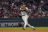 Houston Astros shortstop Jeremy Pena attempts to throw out Los Angeles Angels' Jonathan Villar at first during the sixth inning of a baseball game Wednesday, July 13, 2022, in Anaheim, Calif. The throw was off target and Villar advanced to second on the play. (AP Photo/Mark J. Terrill)