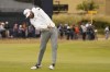 Cameron Young of the US plays a shot on the 18th hole during the first round of the British Open golf championship on the Old Course at St. Andrews, Scotland, Thursday July 14, 2022. The Open Championship returns to the home of golf on July 14-17, 2022, to celebrate the 150th edition of the sport's oldest championship, which dates to 1860 and was first played at St. Andrews in 1873. (AP Photo/Gerald Herbert)