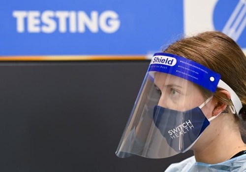 Hailey Knott, nurse operations manager, waits at a COVID-19 testing station located at the international arrivals area at Pearson International Airport in Toronto on Wednesday, January 6, 2021. The federal government says mandatory random testing of travellers arriving at its four main airports will start again next week.THE CANADIAN PRESS/Nathan Denette