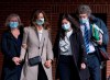 Lisa Banfield, second from left, spouse of Gabriel Wortman, is escorted by friends along with lawyer James Lockyer, right, as they leave Nova Scotia provincial court in Dartmouth, N.S., on Wednesday, March 9, 2022. The lawyer for the wife of the man responsible for the worst mass shooting in modern Canadian history says she is apprehensive about her appearance Friday before a public inquiry. THE CANADIAN PRESS/Andrew Vaughan
