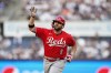 Cincinnati Reds' Mike Moustakas gestures to fans as he runs the bases on a home run during the second inning of the team's baseball game against the New York Yankees on Wednesday, July 13, 2022, in New York. (AP Photo/Frank Franklin II)