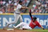 Detroit Tigers second baseman Jonathan Schoop throws to fist after forcing out Cleveland Guardians' Nolan Jones at second base in the sixth inning of a baseball game, Thursday, July 14, 2022, in Cleveland. Austin Hedges was out at first for a double play. (AP Photo/David Dermer)