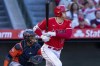 Los Angeles Angels' Shohei Ohtani, right, watches his groundout, next to Houston Astros catcher Martin Maldonado during the sixth inning of a baseball game in Anaheim, Calif., Thursday, July 14, 2022. (AP Photo/Alex Gallardo)