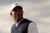 Tiger Woods of the US walks up to the 13th tee during the first round of the British Open golf championship on the Old Course at St. Andrews, Scotland, Thursday July 14, 2022. The Open Championship returns to the home of golf on July 14-17, 2022, to celebrate the 150th edition of the sport's oldest championship, which dates to 1860 and was first played at St. Andrews in 1873. (AP Photo/Gerald Herbert)