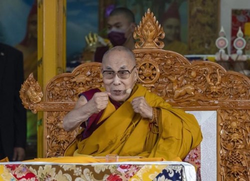 FILE- Tibetan spiritual leader the Dalai Lama gestures to indicate that he is in good health during a religious talk at the Tsuglakhang temple in Dharmsala, India, Friday, March 18, 2022. The Dalai Lama on Friday, July 15, 2022, arrived in the remote Ladakh region bordering China where he received a rousing reception. He will stay in Ladakh for about 45 days. (AP Photo/Ashwini Bhatia, File)