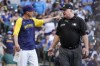 Milwaukee Brewers manager Craig Counsell argues with upmire Bill Miller during the ninth inning of a baseball game against the Pittsburgh Pirates Saturday, July 9, 2022, in Milwaukee. (AP Photo/Morry Gash)