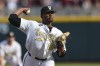 FILE - Vanderbilt pitcher Kumar Rocker (80) throws during the first inning in Game 3 of the NCAA College World Series baseball finals on June 30, 2021, in Omaha, Neb. Former Vanderbilt star right-hander Rocker is ready for a second go-round in the MLB draft. A brief professional tune-up has him on track to be selected as early as the first round when the draft begins on Sunday, July 17, 2022, in Los Angeles. (AP Photo/Rebecca S. Gratz, File)