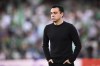 FILE - Barcelona's head coach Xavi Hernandez reacts during the Spanish La Liga soccer match between Real Betis and Barcelona at Benito Villamarin stadium in Seville, Spain, Saturday, May 7, 2022. Xavi has missed his team's flight for a preseason tour of the United States because of problems with his passport, the Spanish club said Saturday, July 16, 2022. (AP Photo/Jose Breton, File)