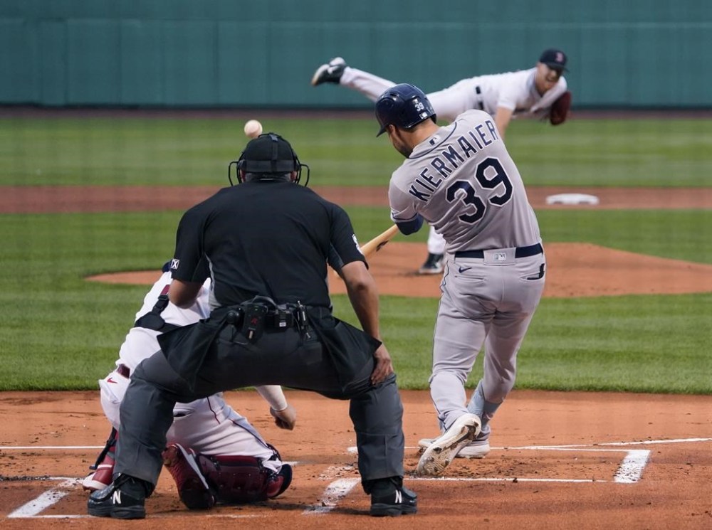 Tampa Bay Rays' Kevin Kiermaier (39) hits a three-run double off Boston Red Sox starting pitcher Nick Pivetta (37) during the first inning of a baseball game at Fenway Park, Tuesday, July 5, 2022, in Boston. (AP Photo/Mary Schwalm)