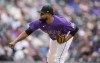 Colorado Rockies relief pitcher Alex Colome works against the Pittsburgh Pirates during the eighth inning of a baseball game Saturday, July 16, 2022, in Denver. (AP Photo/David Zalubowski)