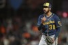 Milwaukee Brewers' Devin Williams reacts after a flyout by San Francisco Giants' LaMonte Wade Jr. in the 10th inning ended the baseball game in San Francisco, Thursday, July 14, 2022. (AP Photo/Godofredo A. Vásquez)