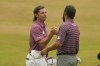 Cameron Smith, of Australia, left, shakes hands with Cameron Young of the US after their final round of the British Open golf championship on the Old Course at St. Andrews, Scotland, Sunday July 17, 2022. (AP Photo/Gerald Herbert)