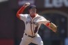 San Francisco Giants' Logan Webb pitches against the Milwaukee Brewers during the first inning of a baseball game in San Francisco, Sunday, July 17, 2022. The Giants are wearing San Francisco Sea Lions jerseys to honor African American Heritage Day. (AP Photo/Jeff Chiu)