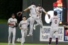 FILE - Cleveland Guardians' Amed Rosario (1) and Myles Straw jump between Oscar Gonzalez, left, Steven Kwan and Andres Gimenez (0) after the Guardians defeated the Minnesota Twins in a baseball game Wednesday, June 22, 2022, in Minneapolis. Under manager Terry Francona, baseball’s youngest team — the Guardians' average batting age (26.1) and average pitching age (26.5) are below Triple-A averages — is having fun while also developing into a playoff contender sooner than expected.(AP Photo/Andy Clayton-King)