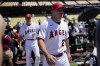 Los Angeles Angels' Mike Trout, right, and Shohei Ohtani enter the field during batting practice a day before the 2022 MLB All-Star baseball game, Monday, July 18, 2022, in Los Angeles. (AP Photo/Jae C. Hong)