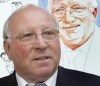 FILE - Former soccer player German Uwe Seeler poses in front of his portrait prior to the opening of the exhibition 