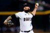 Arizona Diamondbacks starting pitcher Dallas Keuchel throws to a Colorado Rockies batter during the first inning of a baseball game Thursday, July 7, 2022, in Phoenix. (AP Photo/Ross D. Franklin)