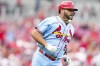 St. Louis Cardinals' Albert Pujols runs after hitting a single during the second inning of a baseball game against the Cincinnati Reds, Saturday, July 23, 2022, in Cincinnati. (AP Photo/Jeff Dean)