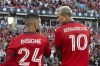 Toronto FC's Lorenzo Insigne chats with teammate Federico Bernardeschi before MLS action against Charlotte FC in Toronto on Saturday July 23, 2022. THE CANADIAN PRESS/Chris Young