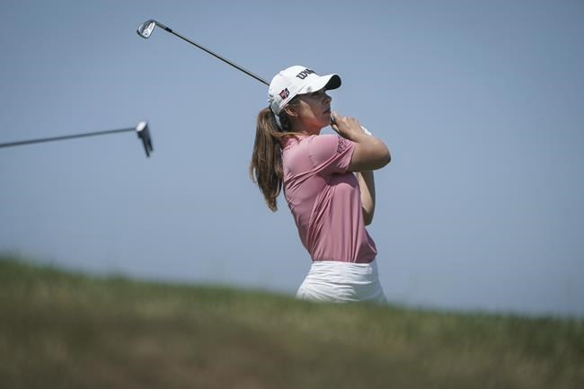 Sophia Schubert, of the United States, follows her ball after playing on the 5th hole during the last round of the Evian Championship women's golf tournament in Evian, eastern France, Sunday, July 24, 2022. (AP Photo/Laurent Cipriani)