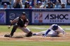 Los Angeles Dodgers' Gavin Lux, right, scores on a double by Max Muncy as San Francisco Giants catcher Joey Bart takes a late throw during the third inning of a baseball game Sunday, July 24, 2022, in Los Angeles. (AP Photo/Mark J. Terrill)
