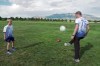 In this photo provided by Vince Trujillo, David Certain, right, plays soccer with his son Nico in Albuquerque, New Mexico, Thursday, July 21, 2022. Certain, a Colombian soccer lover who came to the United States as a political refugee, has united several former professional Colombian soccer players to join him in creating a youth sports education program in New Mexico in July 2022. (Vince Trujillo via AP)