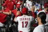 Cincinnati Reds' Kyle Farmer (17) celebrates with teammates after scoring on a Matt Reynolds single during the sixth inning of a baseball game against the Miami Marlins, Monday, July 25, 2022, in Cincinnati. (AP Photo/Jeff Dean)