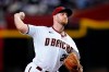 Arizona Diamondbacks starting pitcher Merrill Kelly throws against the San Francisco Giants during the first inning of a baseball game Monday, July 25, 2022, in Phoenix. (AP Photo/Ross D. Franklin)