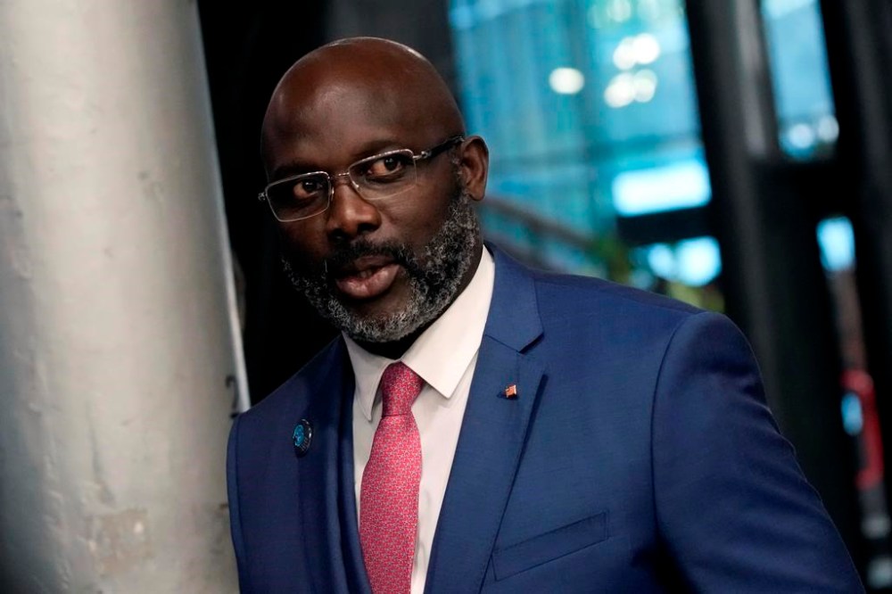 FILE - Liberia President George Weah arrives to attend the Paris Peace Forum, in Paris, France, Nov. 11, 2021. Liberia is celebrating two major anniversaries this year — 200 years ago freed slaves from the U.S. arrived here and 25 years later they declared the country to be independent. Amid the festivities for Independence Day on Tuesday July 26, 2022, many Liberians say the West African country's promise is unfulfilled and too many of its people still live in poverty. (AP Photo/Christophe Ena, File)