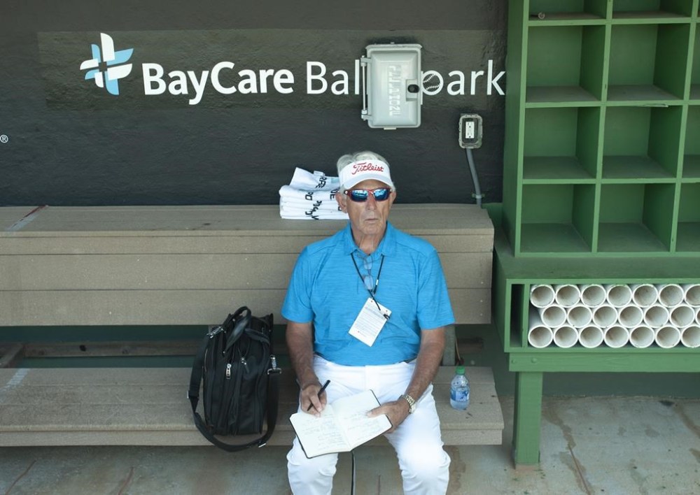 Toronto Blue Jays broadcaster Buck Martinez sits in the Jays' dugout before a spring training game at BayCare Ballpark, in Clearwater, Fla., Saturday, March 20, 2022. Martinez will be making his return to the booth Tuesday night when Toronto takes on the St. Louis Cardinals.THE CANADIAN PRESS/Mark Taylor