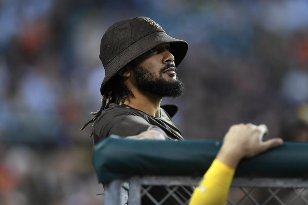 San Diego Padres' Fernando Tatis Jr. watches a baseball game from the dugout in the fifth inning against the Detroit Tigers, Monday, July 25, 2022, in Detroit. (AP Photo/Jose Juarez)
