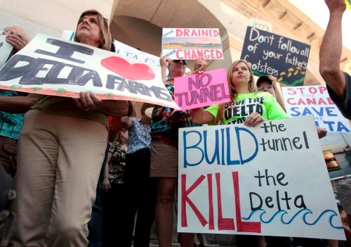 FILE -- Demonstrators rallied at the Capitol to protest a plan announced by Gov. Jerry Brown to build a giant twin tunnel system to move water from the Sacramento-San Joaquin River Delta to Southern California, Wednesday July 25, 2012. Gov. Gain Newsom's administration has scaled the project back to a single tunnel, but the project still has many critics. The state Department of Water Resources released a report on July 27, 2022, outlining their preferred route for the giant water system, which will reroute water from the north to the south. (AP Photo/Rich Pedroncelli, File)