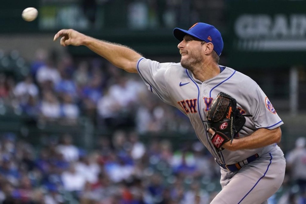 New York Mets starting pitcher Max Scherzer throws against the Chicago Cubs during the first inning in the second baseball game of a doubleheader in Chicago, Saturday, July 16, 2022. (AP Photo/Nam Y. Huh)