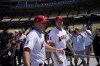 Los Angeles Angels' Mike Trout, left, and Shohei Ohtani enter the field during batting practice a day before the 2022 MLB All-Star baseball game, Monday, July 18, 2022, in Los Angeles. (AP Photo/Jae C. Hong)