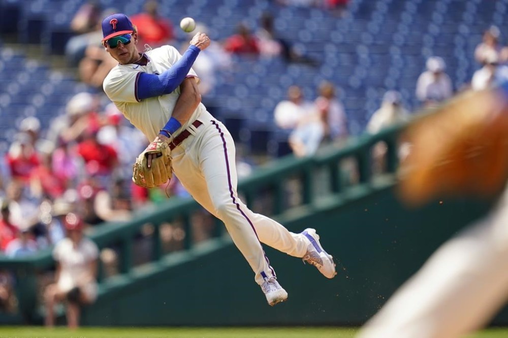 Philadelphia Phillies third baseman Alec Bohm throws to first after fielding a ground out by Atlanta Braves' Michael Harris II during the eighth inning of a baseball game, Wednesday, July 27, 2022, in Philadelphia. (AP Photo/Matt Slocum)
