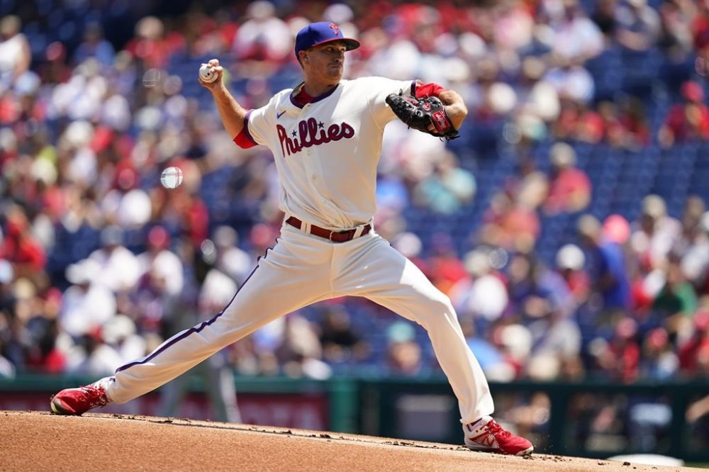 Philadelphia Phillies' Kyle Gibson pitches during the first inning of a baseball game against the Atlanta Braves, Wednesday, July 27, 2022, in Philadelphia. (AP Photo/Matt Slocum)