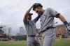 Tampa Bay Rays' Brett Phillips, left, takes the helmet off Luke Raley as he arrives at the dugout after hitting a solo home run against the Baltimore Orioles during the third inning of a baseball game, Wednesday, July 27, 2022, in Baltimore. (AP Photo/Julio Cortez)