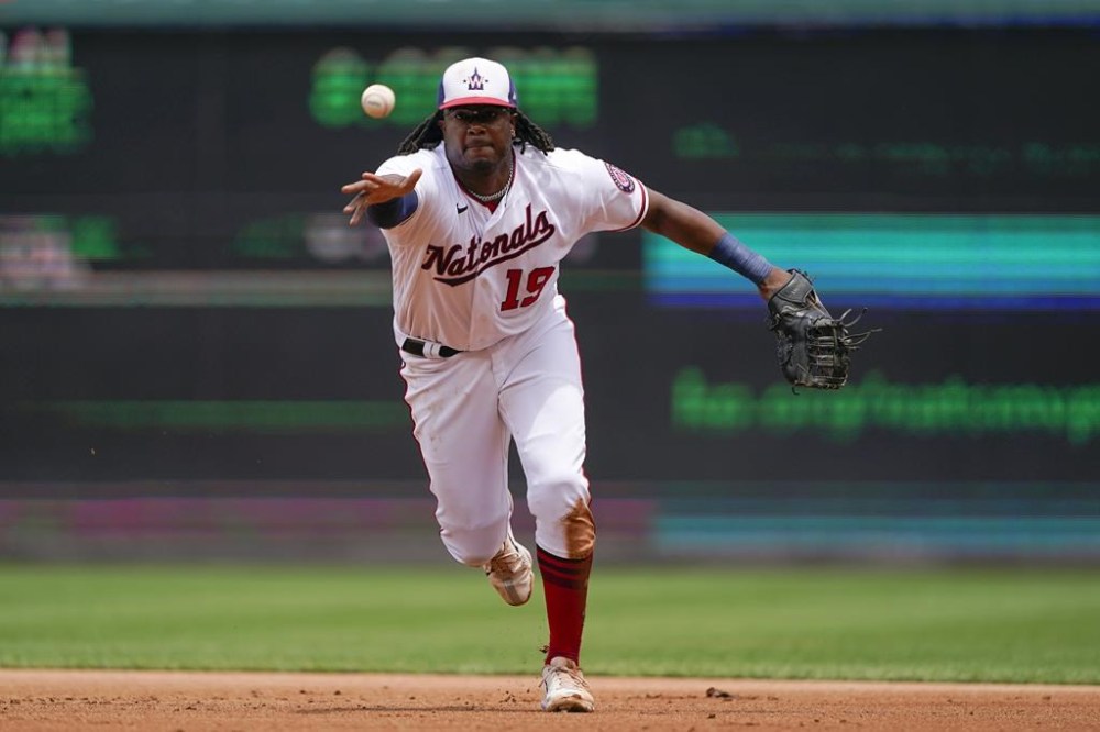 Washington Nationals first baseman Josh Bell fields a ground ball that was hit by Seattle Mariners' Jesse Winker in the fifth inning of the first game of a baseball doubleheader, Wednesday, July 13, 2022, in Washington. (AP Photo/Patrick Semansky)