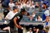 New York Yankees' Andrew Benintendi, left, talks to Kansas City Royals catcher MJ Melendez, right, during the first inning of a baseball game Thursday, July 28, 2022, in New York. (AP Photo/Frank Franklin II)