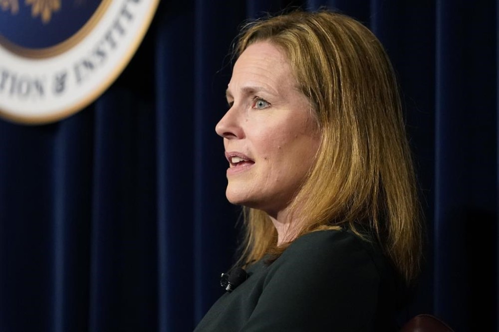 FILE - U.S. Supreme Court Associate Justice Amy Coney Barrett speaks at the Ronald Reagan Presidential Library Foundation in Simi Valley, Calif., April 4, 2022. Two of the Supreme Court justices who disagree most often on the outcomes of cases say they both still try hard to persuade each other, and sometimes succeed. Justice Sonia Sotomayor and Justice Amy Coney Barrett made the comments in a pretaped conversation made public for the first time Thursday evening, July 28, 2022. (AP Photo/Damian Dovarganes, File)