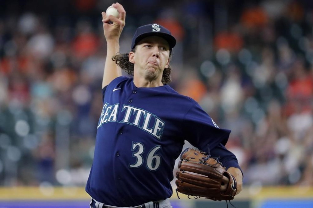 Seattle Mariners starting pitcher Logan Gilbert throws to a Houston Astros batter during the first inning of a baseball game Thursday, July 28, 2022, in Houston. (AP Photo/Michael Wyke)