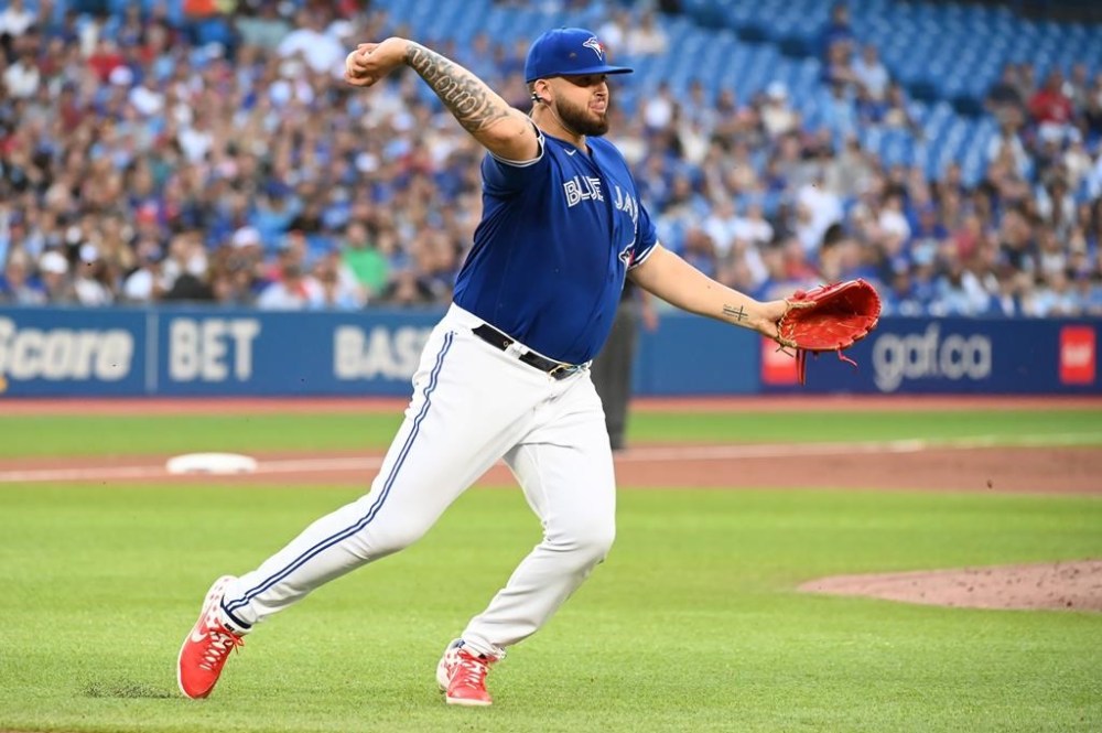 Toronto Blue Jays starting pitcher Alek Manoah throws to first base to put out Detroit Tigers’ Jeimer Candelario in the second inning of American League baseball action in Toronto, Friday, July 29, 2022. THE CANADIAN PRESS/Jon Blacker