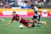 Toronto FC's Jonathan Osorio, left, stumbles as he and Vancouver Whitecaps' Andres Cubas vie for the ball during the first half of the Canadian Championship soccer final, in Vancouver, on Tuesday, July 26, 2022. THE CANADIAN PRESS/Darryl Dyck