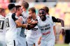 Elversberg's team celebrates victory against Bayer Leverkusen in a first round match of the DFB cup in Spiesen-Elversberg, Germany, Saturday, July 30, 2022. (Uwe Anspach/dpa via AP)