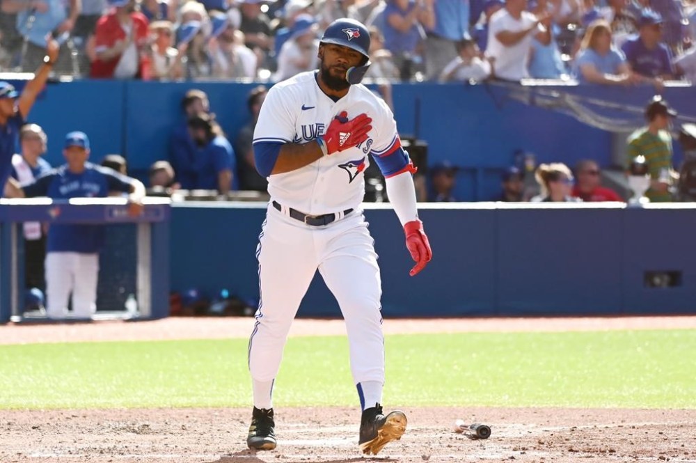 Toronto Blue Jays right fielder Teoscar Hernandez reacts after hitting a three-run home run, scoring Vladimir Guerrero Jr. and Lourdes Gurriel Jr. against the Detroit Tigers in the sixth inning of American League baseball action against the Detroit Tigers in Toronto, Saturday, July 30, 2022. THE CANADIAN PRESS/Jon Blacker
