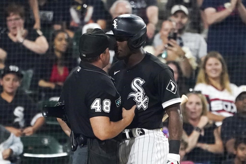Chicago White Sox's Tim Anderson, right, gets in the face of home plate umpire Nick Mahrley after Anderson made contact with Mahrley during the seventh inning of a baseball game against the Oakland Athletics on Friday, July 29, 2022, in Chicago. Anderson was ejected. (AP Photo/Charles Rex Arbogast)