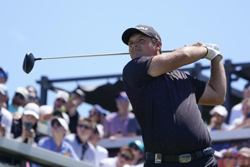 Patrick Reed hits off the first tee during the second round of the Bedminster Invitational LIV Golf tournament in Bedminster, N.J., Saturday, July 30, 2022. (AP Photo/Seth Wenig)