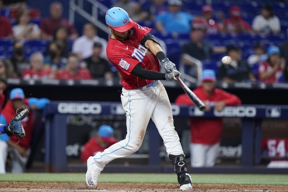 Miami Marlins' Charles Leblanc hits a double during the eighth inning of a baseball game against the New York Mets, Saturday, July 30, 2022, in Miami. (AP Photo/Wilfredo Lee)