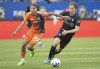 CF Montreal's Lassi Lappalainen, right, challenges New York City FC's Gabriel Pereira during first half MLS soccer action in Montreal, Saturday, July 30, 2022. THE CANADIAN PRESS/Graham Hughes